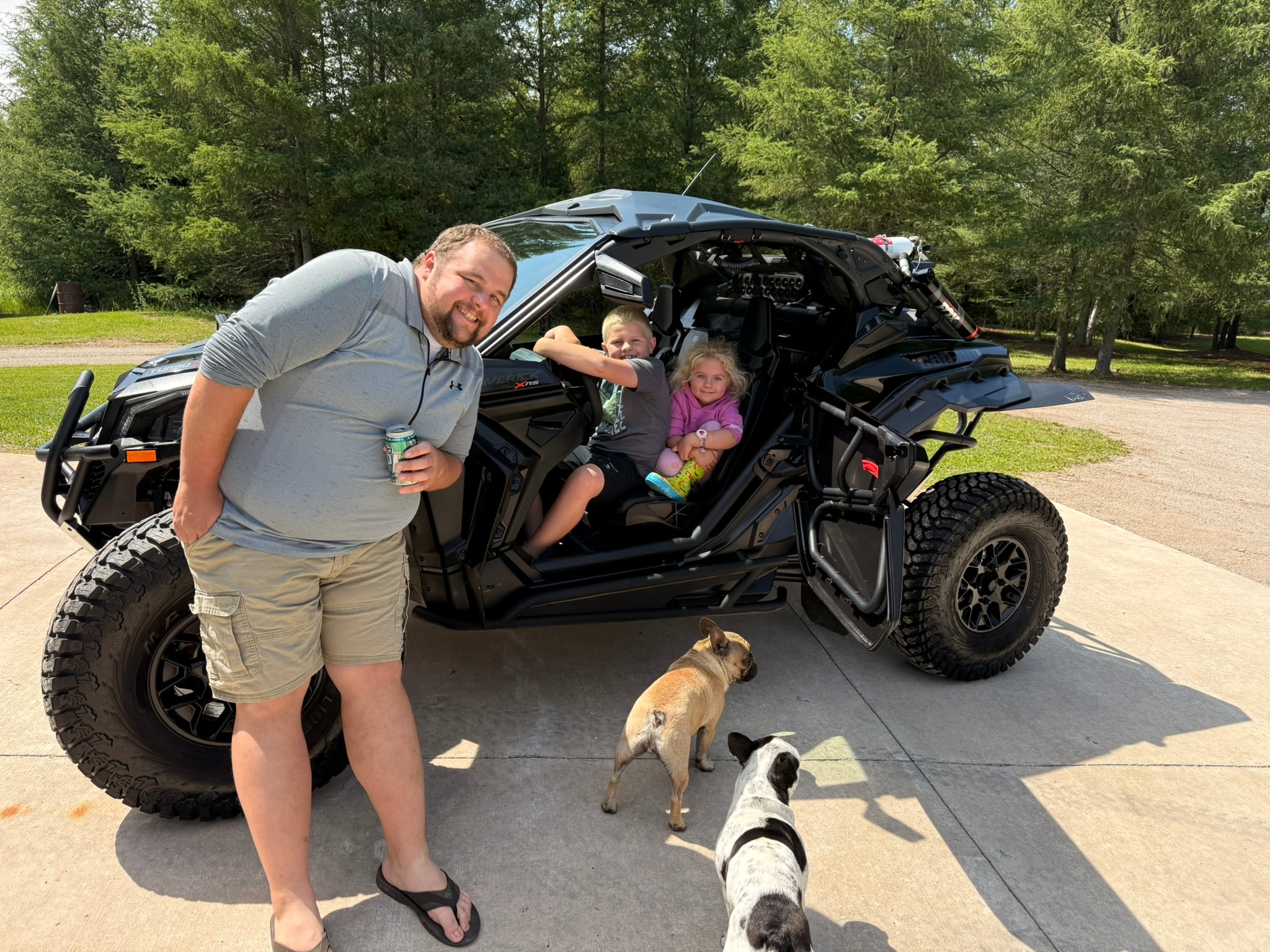 Family with SxS and dogs